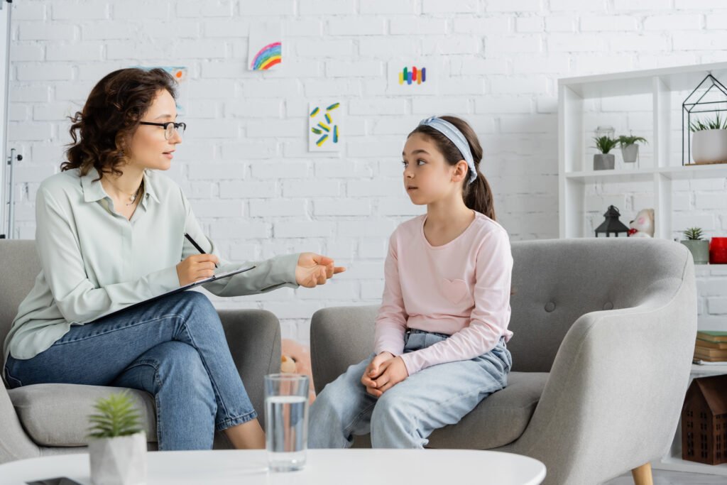 Child speaking with a therapist for Scarborough ADHD parent guide