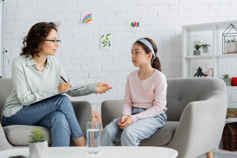 Child speaking with a therapist for Scarborough ADHD parent guide