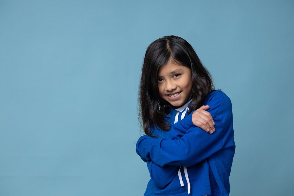 Smiling child in a blue hoodie for Brampton ADHD support article
