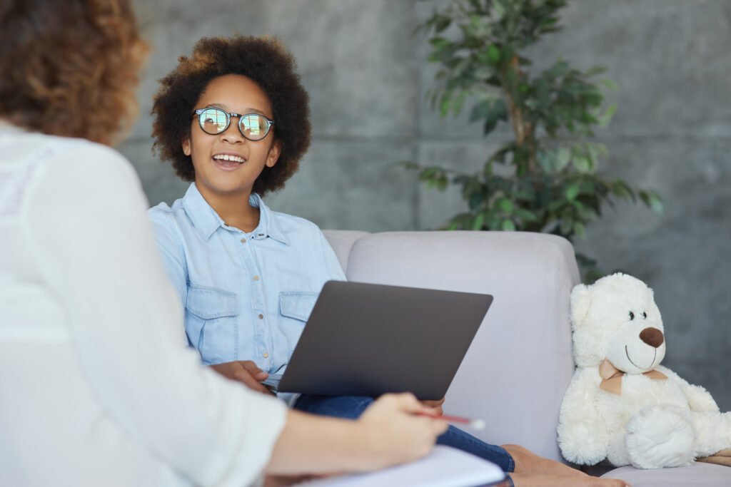 Smiling teen speaking with an adult for Markham ADHD parent guide