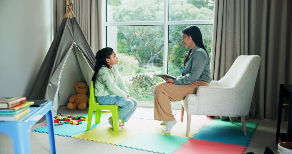 Child psychologist speaking with a child during therapy in Scarborough
