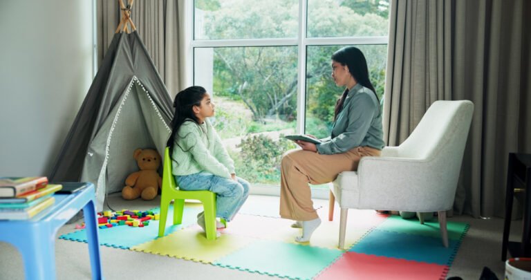 Child psychologist speaking with a child during therapy in Scarborough