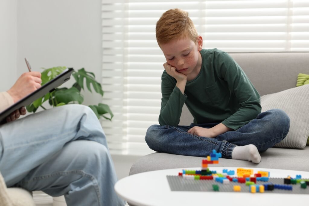 Child psychologist supporting a boy during therapy in Vaughan, Concord and Woodbridge